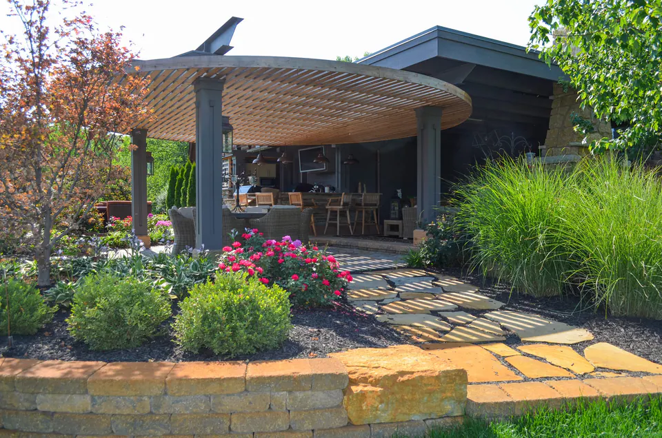 Paver walk and planting around a covered outdoor room